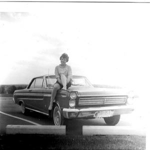 My mom on their 65 Mercury Cyclone in April 65