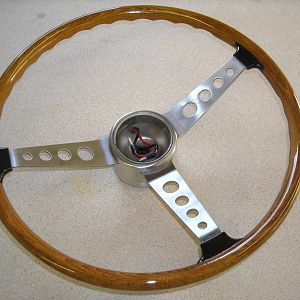 1967 wheel that needed new wood and spoke tabs (black boots).