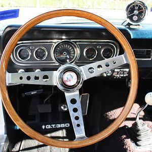 Original Shelby steering wheel and tachometer.